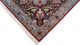 Backside of handmade 1980s Kashan rug showing knot structure and weave density