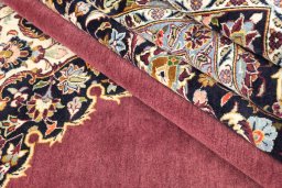 Corner detail of 1980s Kashan rug showing border pattern and Wool pile
