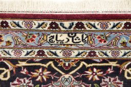 Backside of handmade 1980s Kashan rug showing knot structure and weave density