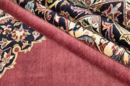 Corner detail of 1980s Kashan rug showing border pattern and Wool pile