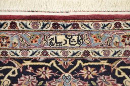 Backside of handmade 1980s Kashan rug showing knot structure and weave density