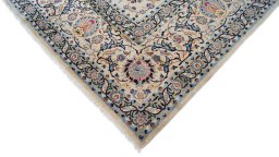 Backside of handmade 1970s Kashan rug showing knot structure and weave density