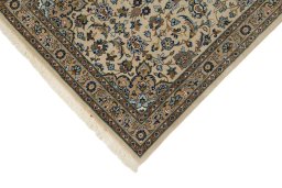 Backside of handmade 1990s Kashan rug showing knot structure and weave density