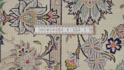 Corner detail of 1990s Kashan rug showing border pattern and Silk pile