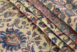 Corner detail of 1900s Kashan rug showing border pattern and Silk pile