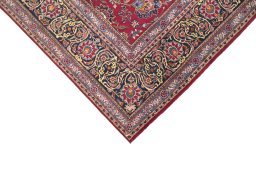 Backside of handmade 1950s Kashan rug showing knot structure and weave density