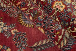 Corner detail of 1950s Kashan rug showing border pattern and Wool pile