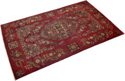 Corner detail of 1950s Kashan rug showing border pattern and Wool pile