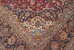 Full view of 1950s Kashan rug from Iran / Persia, 419 × 300 cm in Dark red tones