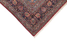 Backside of handmade 1950s Kashan rug showing knot structure and weave density