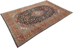 Corner detail of New Kashan rug showing border pattern and Wool pile
