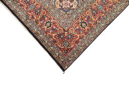 Backside of handmade New Kashan rug showing knot structure and weave density