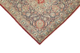 Backside of handmade 1950s Kashan rug showing knot structure and weave density