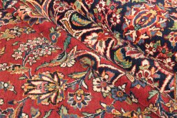 Corner detail of 1950s Kashan rug showing border pattern and Wool pile