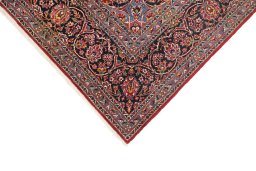Backside of handmade 1950s Kashan rug showing knot structure and weave density