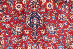 Corner detail of 2000s Kashan rug showing border pattern and Wool pile