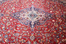 Close-up detail of 2000s Kashan rug from Iran / Persia showing Wool weave