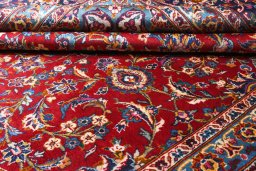 Close-up detail of 2000s Kashan rug from Iran / Persia showing Wool weave