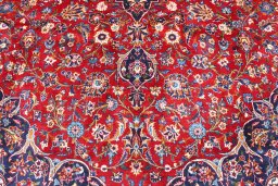 Backside of handmade 2000s Kashan rug showing knot structure and weave density