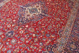 Close-up detail of 2000s Kashan rug from Iran / Persia showing Wool weave