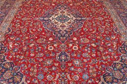 Full view of 2000s Kashan rug from Iran / Persia, 410 × 304 cm in Red tones