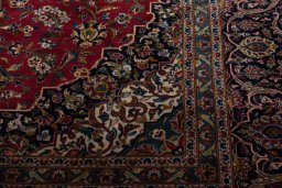 Corner detail of 2000s Kashan rug showing border pattern and Wool pile