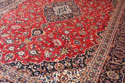Close-up detail of 2000s Kashan rug from Iran / Persia showing Wool weave