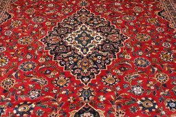 Backside of handmade 2000s Kashan rug showing knot structure and weave density