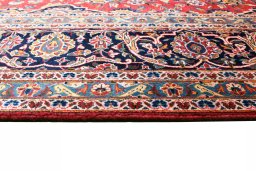 Corner detail of 2000s Kashan rug showing border pattern and Wool pile