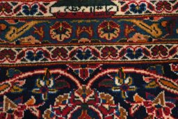 Close-up detail of 2000s Kashan rug from Iran / Persia showing Wool weave