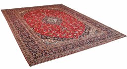Corner detail of 2000s Kashan rug showing border pattern and Wool pile