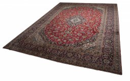 Backside of handmade 2000s Kashan rug showing knot structure and weave density