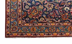 Backside of handmade 2000s Kashan rug showing knot structure and weave density