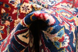 Central medallion detail of 2000s Kashan rug from Iran / Persia