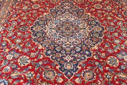 Close-up detail of 2000s Kashan rug from Iran / Persia showing Wool weave