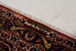 Surface texture of 2000s Kashan rug with natural Wool and intricate pattern