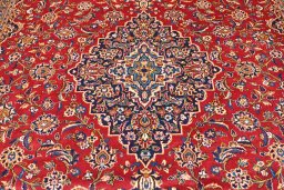 Backside of handmade 2000s Kashan rug showing knot structure and weave density