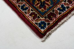 Central medallion detail of 2000s Kashan rug from Iran / Persia