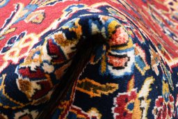 Close-up detail of 2000s Kashan rug from Iran / Persia showing Wool weave