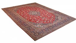 Corner detail of 2000s Kashan rug showing border pattern and Wool pile
