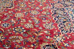 Close-up detail of 2000s Kashan rug from Iran / Persia showing Wool weave