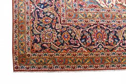 Close-up detail of 2000s Kashan rug from Iran / Persia showing Wool weave
