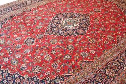 Full view of 2000s Kashan rug from Iran / Persia, 422 × 306 cm in Red tones