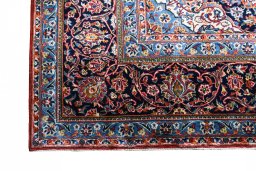 Backside of handmade 2000s Kashan rug showing knot structure and weave density