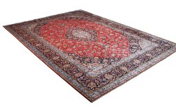 Corner detail of 2000s Kashan rug showing border pattern and Wool pile