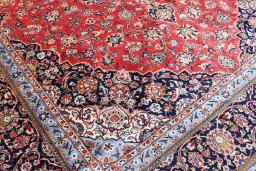 Full view of 2000s Kashan rug from Iran / Persia, 418 × 301 cm in Red tones