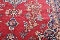 Backside of handmade 1930s Kashan rug showing knot structure and weave density