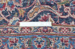 Close-up detail of 1970s Kashan rug from Iran / Persia showing Wool weave