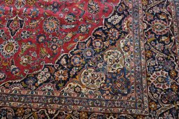 Surface texture of 1970s Kashan rug with natural Wool and intricate pattern