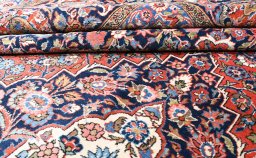 Corner detail of 1930s Kashan rug showing border pattern and Wool pile